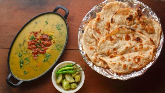 Indian popular food Dal fry or traditional Dal Tadka Curry with Tandoori Roti